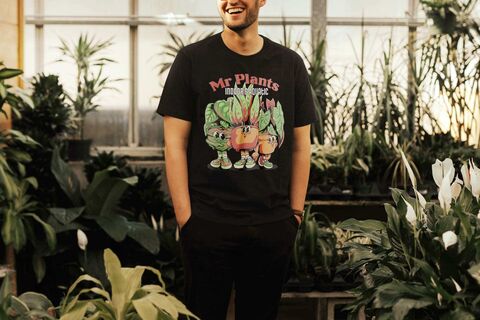 T shirt Black mockup featuring a man surrounded with plants